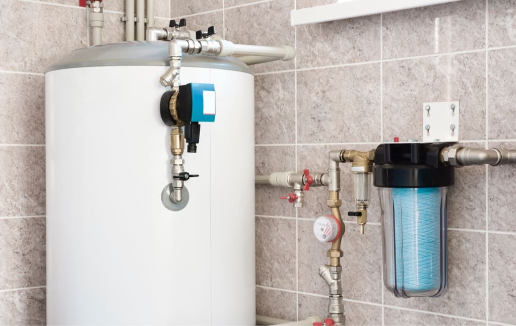 Close Up Shot of a White Hot Water Tank in a Residential Home