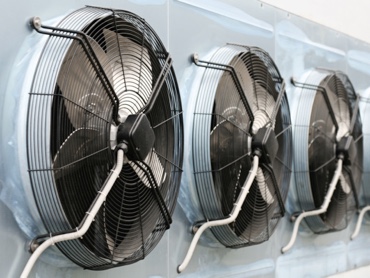Three industrial sized silver fans that display proper HVAC venting