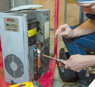 Technical Hot and Cold Technician Working on a Chiller Service Call