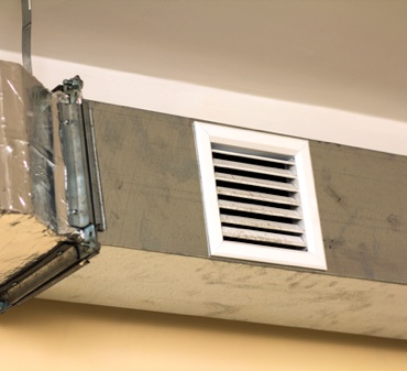 White Air Vent on a Silver Air Conditining Duct